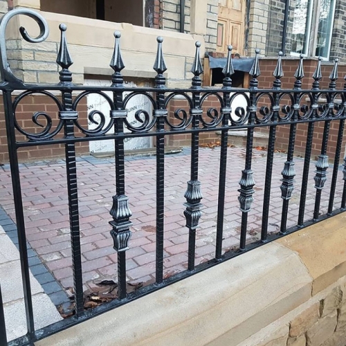 Wrought iron arrow fence